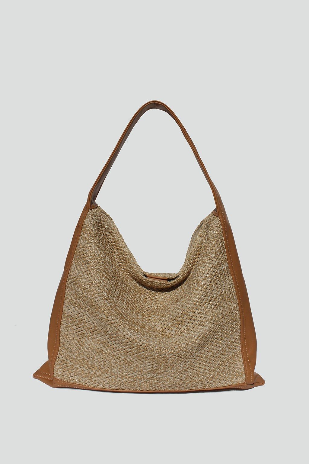 fabric straw tote with tan vegan leather strap.