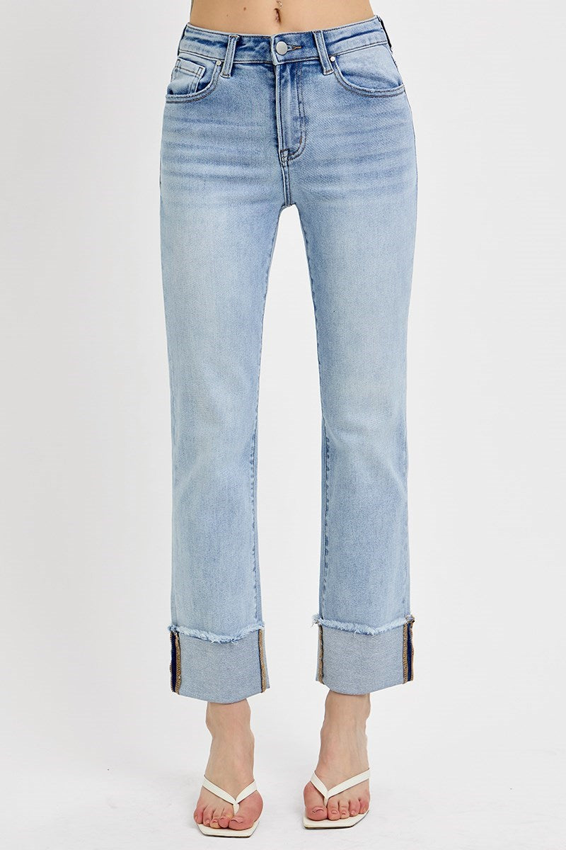 Bottom half of model wearing cuffed, cropped, stretch high waisted jeans